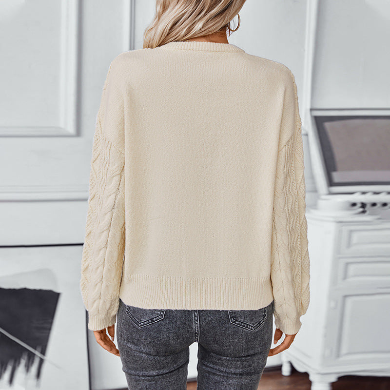 Pull en maille à torsades et manches longues pour femme