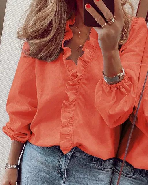 Blouse femme à volants et manches longues