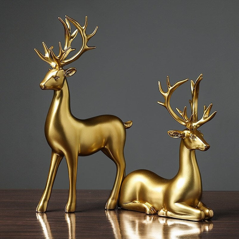 Couple de figurines de cerfs dorés