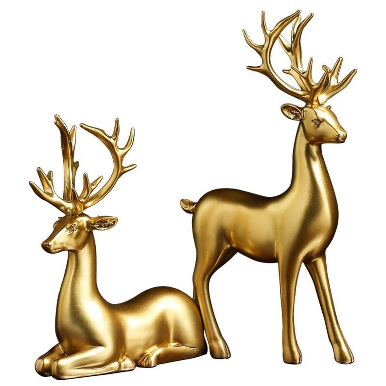 Couple de figurines de cerfs dorés