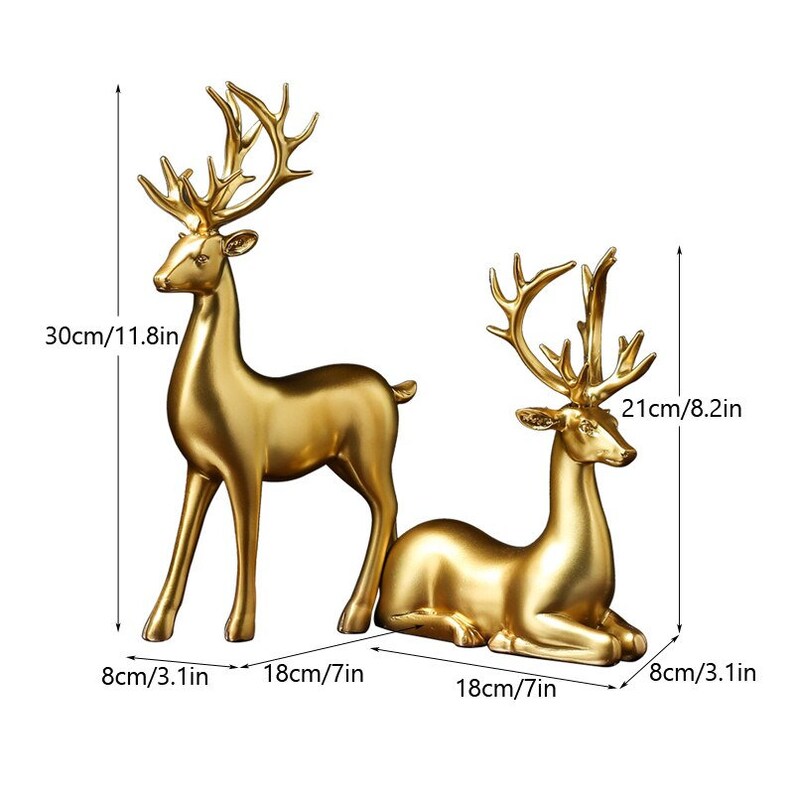 Couple de figurines de cerfs dorés