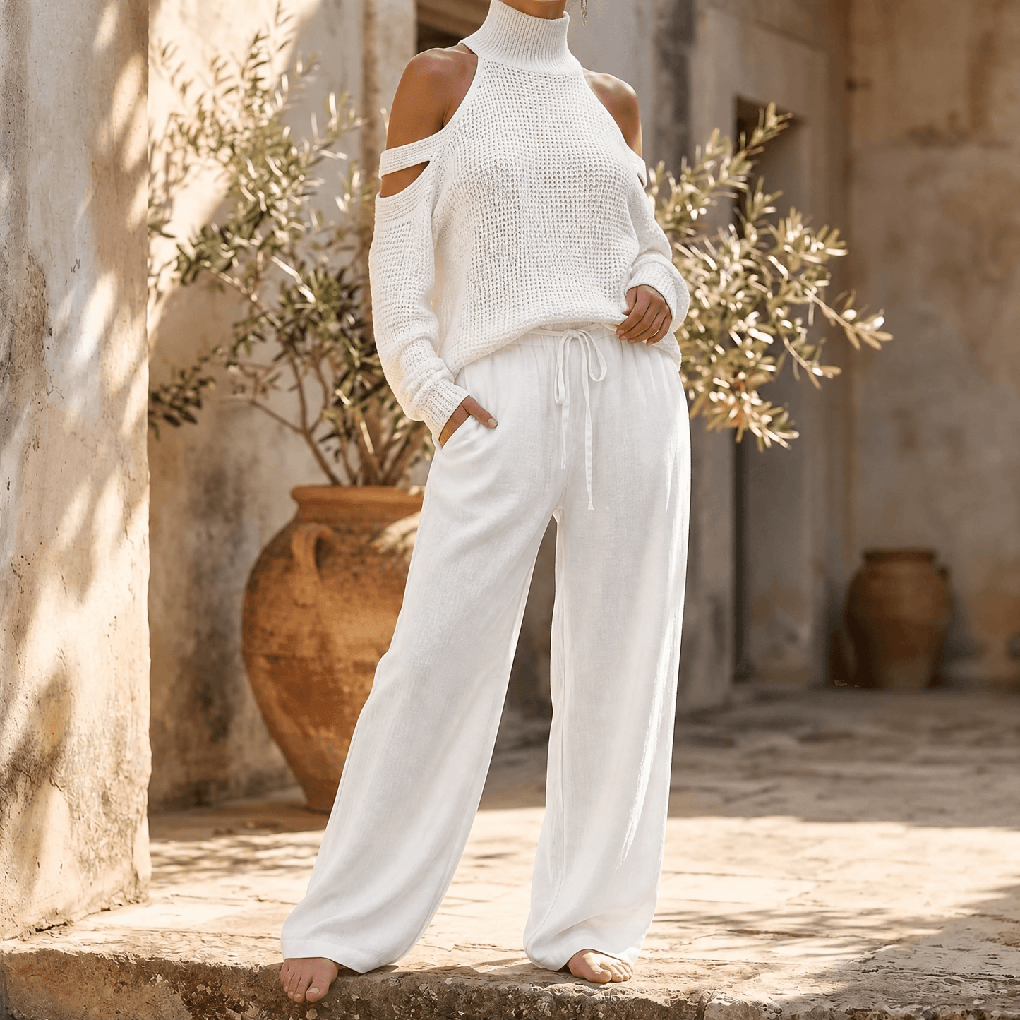 Ensemble pour femme avec pull en maille à épaules dénudées et pantalon fluide