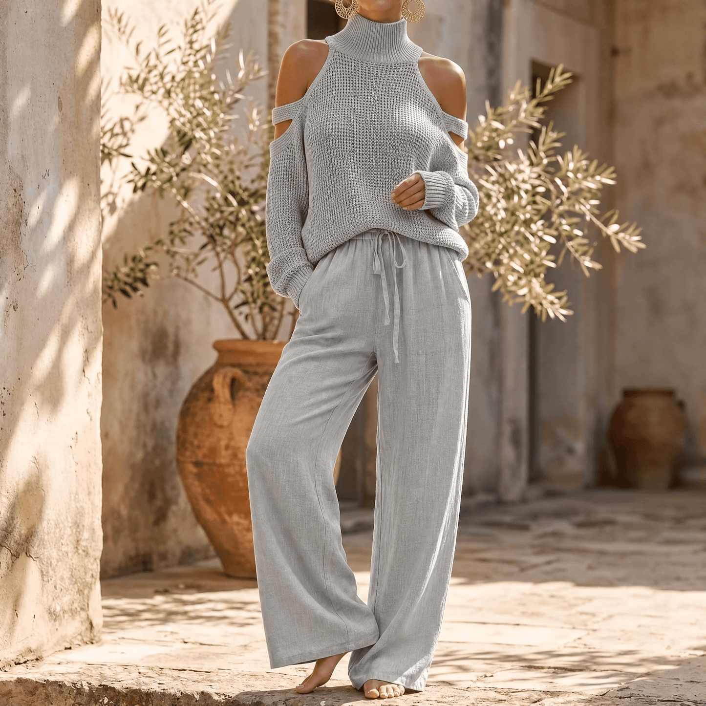 Ensemble pour femme avec pull en maille à épaules dénudées et pantalon fluide