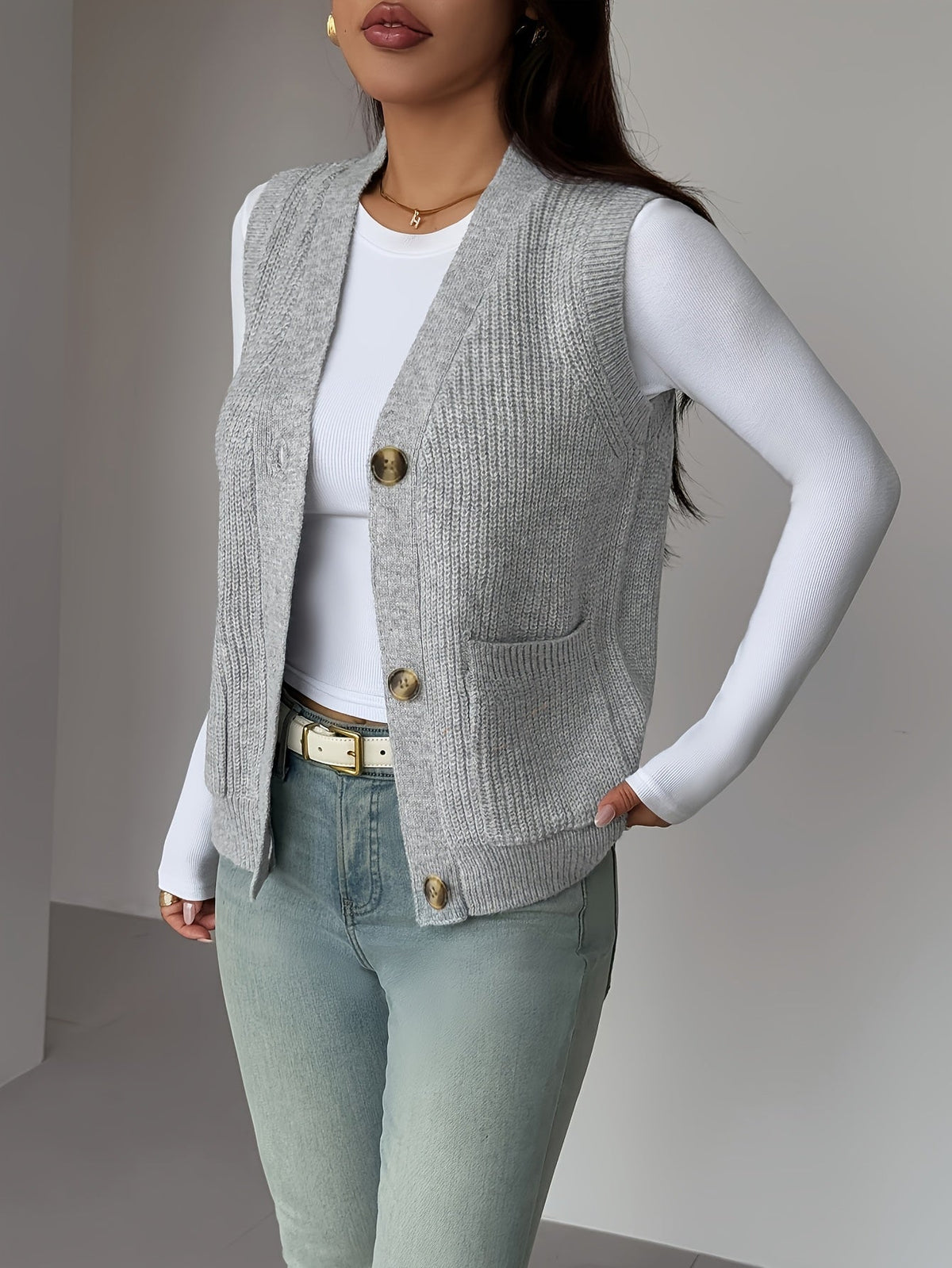 Gilet sans manches boutonné en maille à col en V