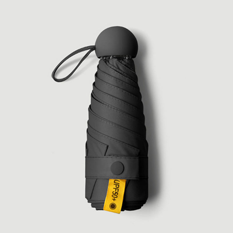 Parapluie de poche forme capsule avec protection solaire UPF50