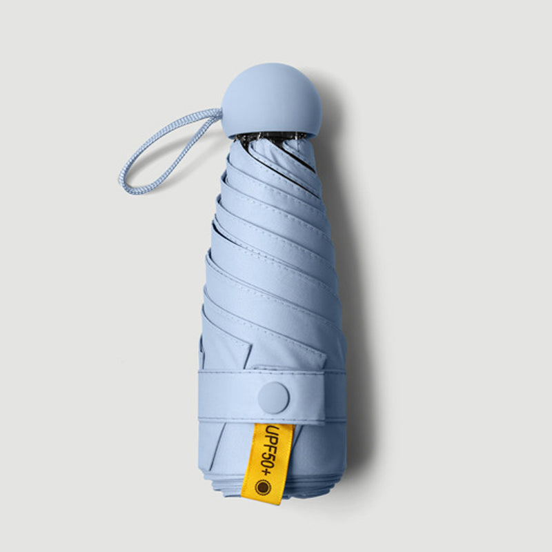 Parapluie de poche forme capsule avec protection solaire UPF50