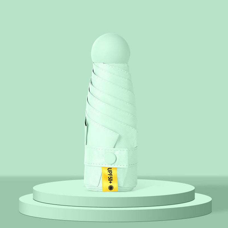 Parapluie de poche forme capsule avec protection solaire UPF50