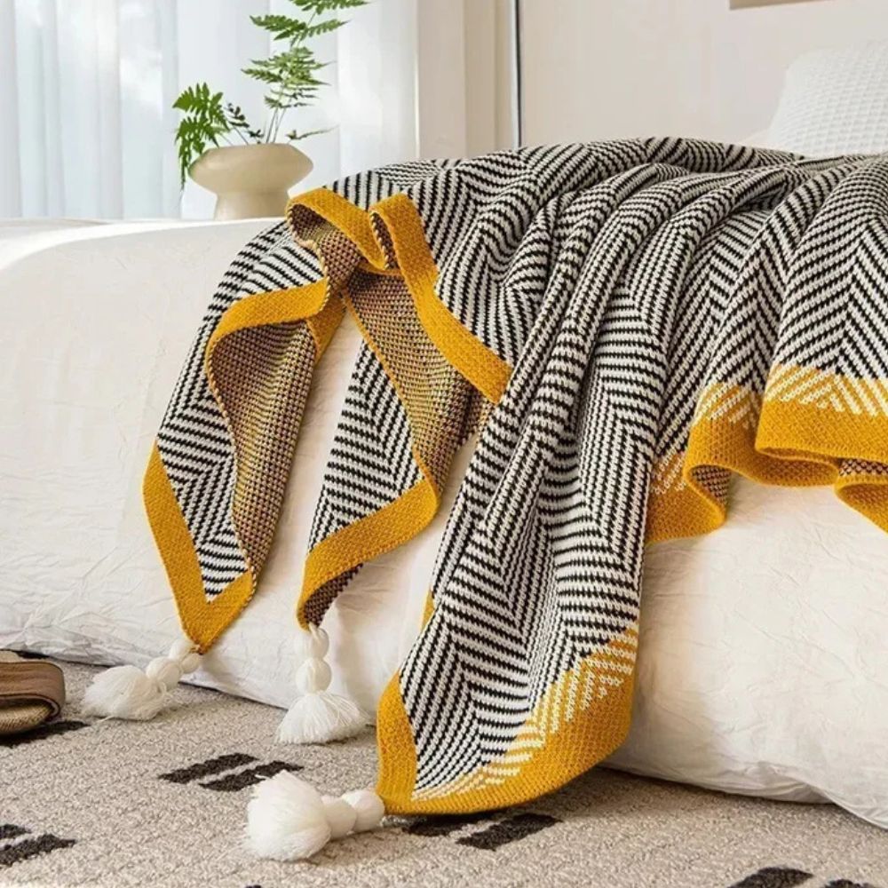 Plaid luxueux à motif chevron doré