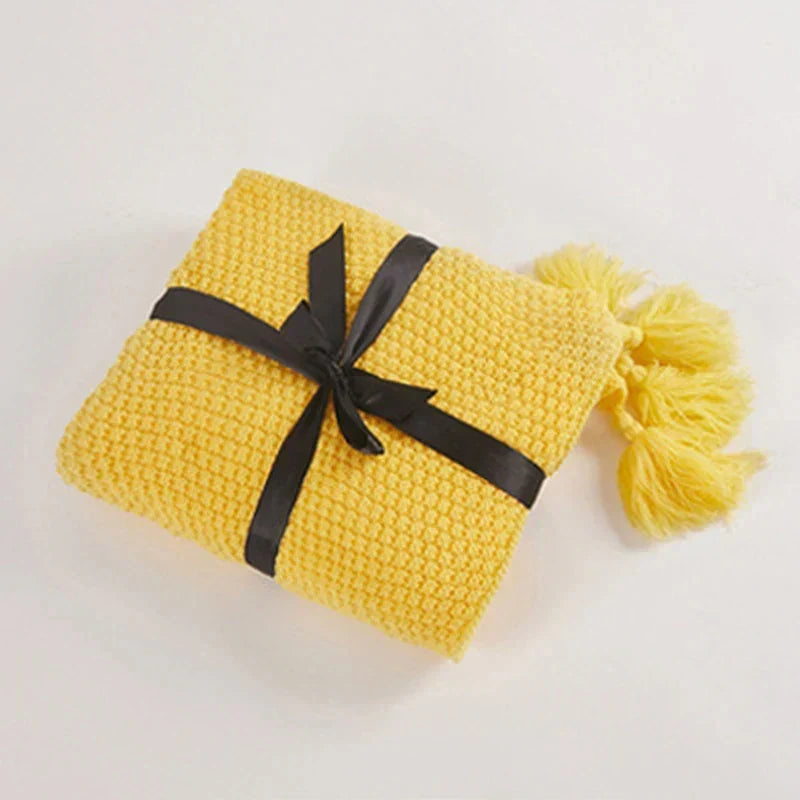 Plaid tricoté en laine avec franges