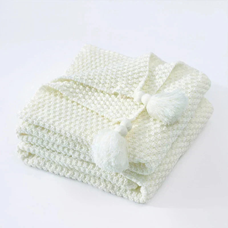 Plaid tricoté en laine avec franges