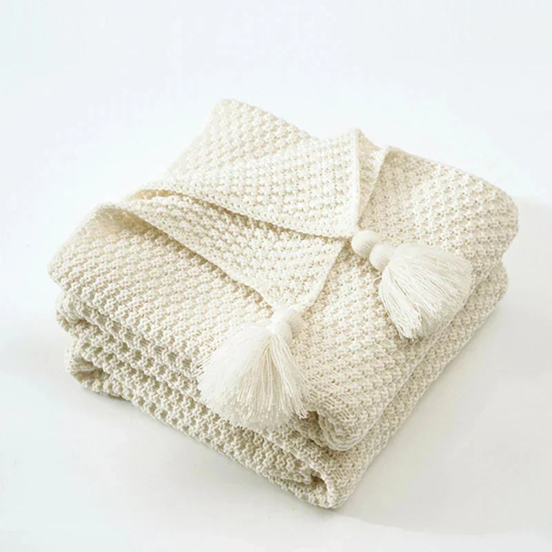 Plaid tricoté en laine avec franges