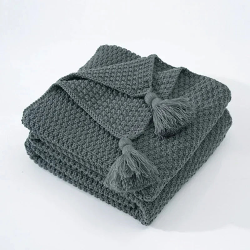 Plaid tricoté en laine avec franges