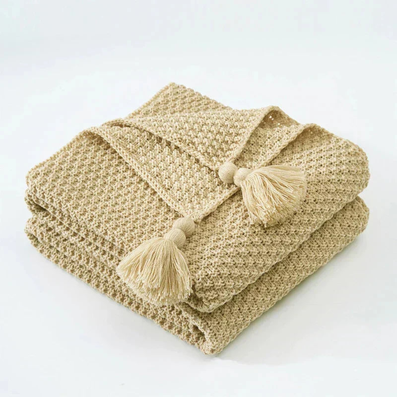 Plaid tricoté en laine avec franges