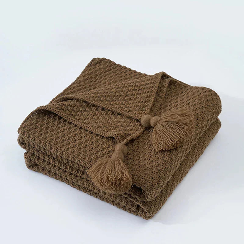 Plaid tricoté en laine avec franges