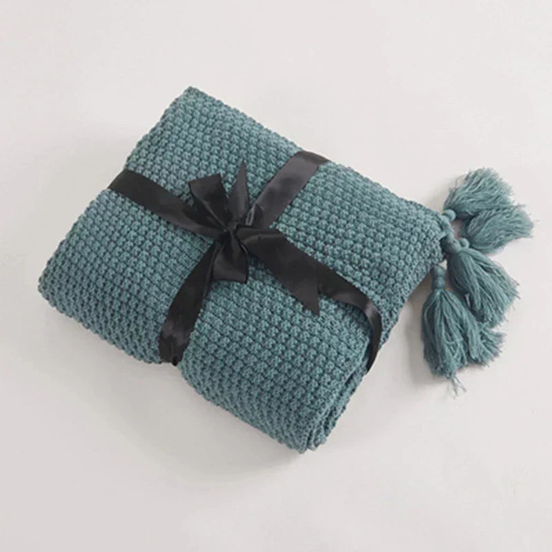 Plaid tricoté en laine avec franges