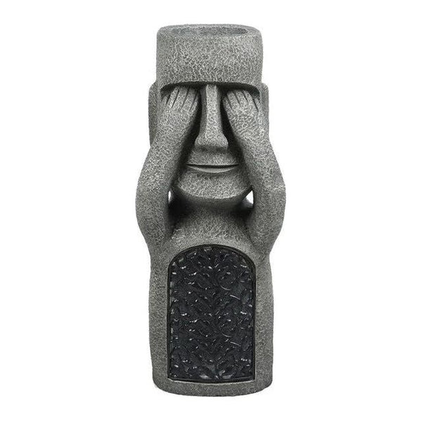 Pot à fleurs avec visage sculpté