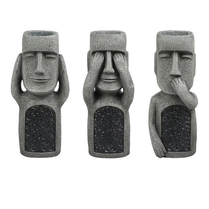 Pot à fleurs avec visage sculpté