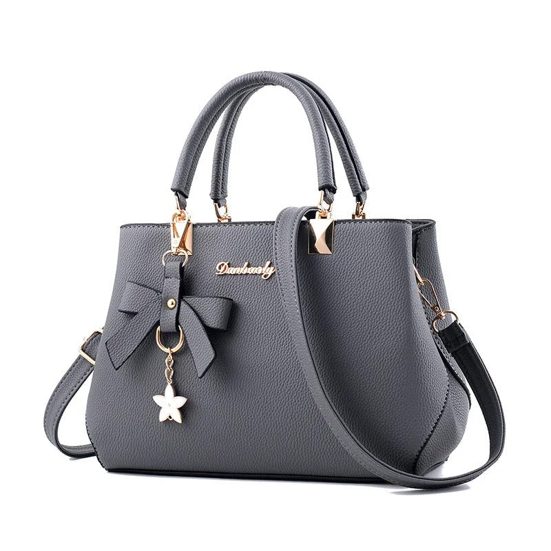 Sac bandoulière pour femme avec pendentif fleur