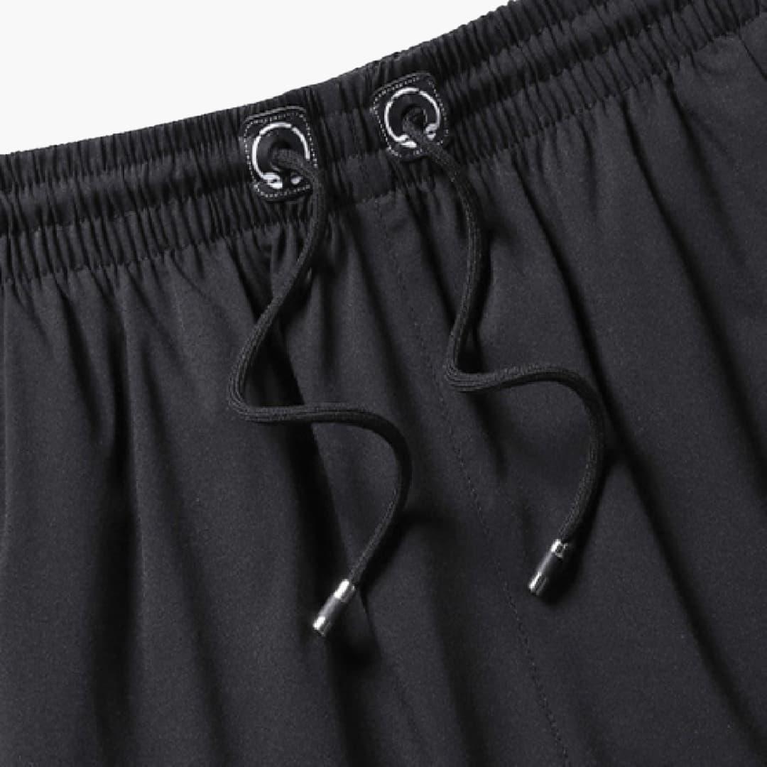Short de sport homme avec poches zippées et cordon de serrage à la taille