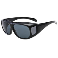 Lunettes de soleil par-dessus les lunettes