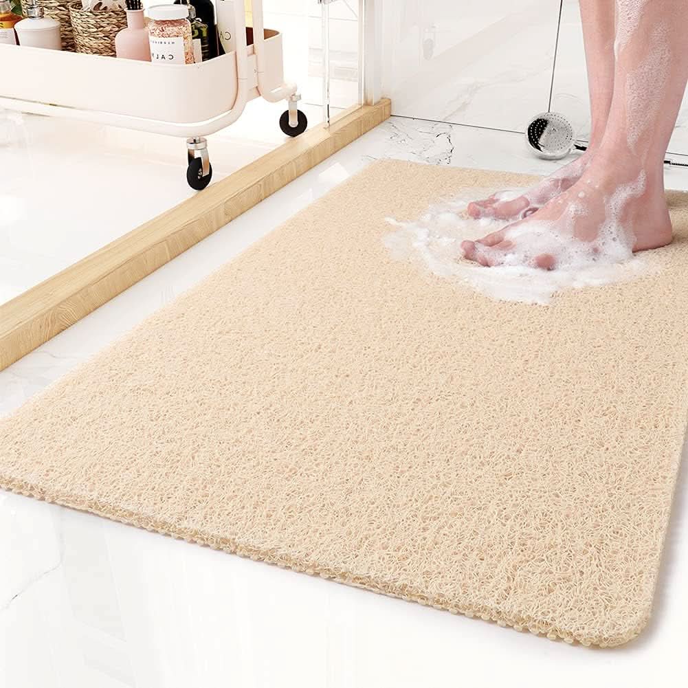 Tapis de douche antidérapant avec système d'évacuation