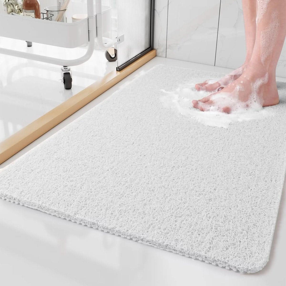 Tapis de douche antidérapant avec système d'évacuation
