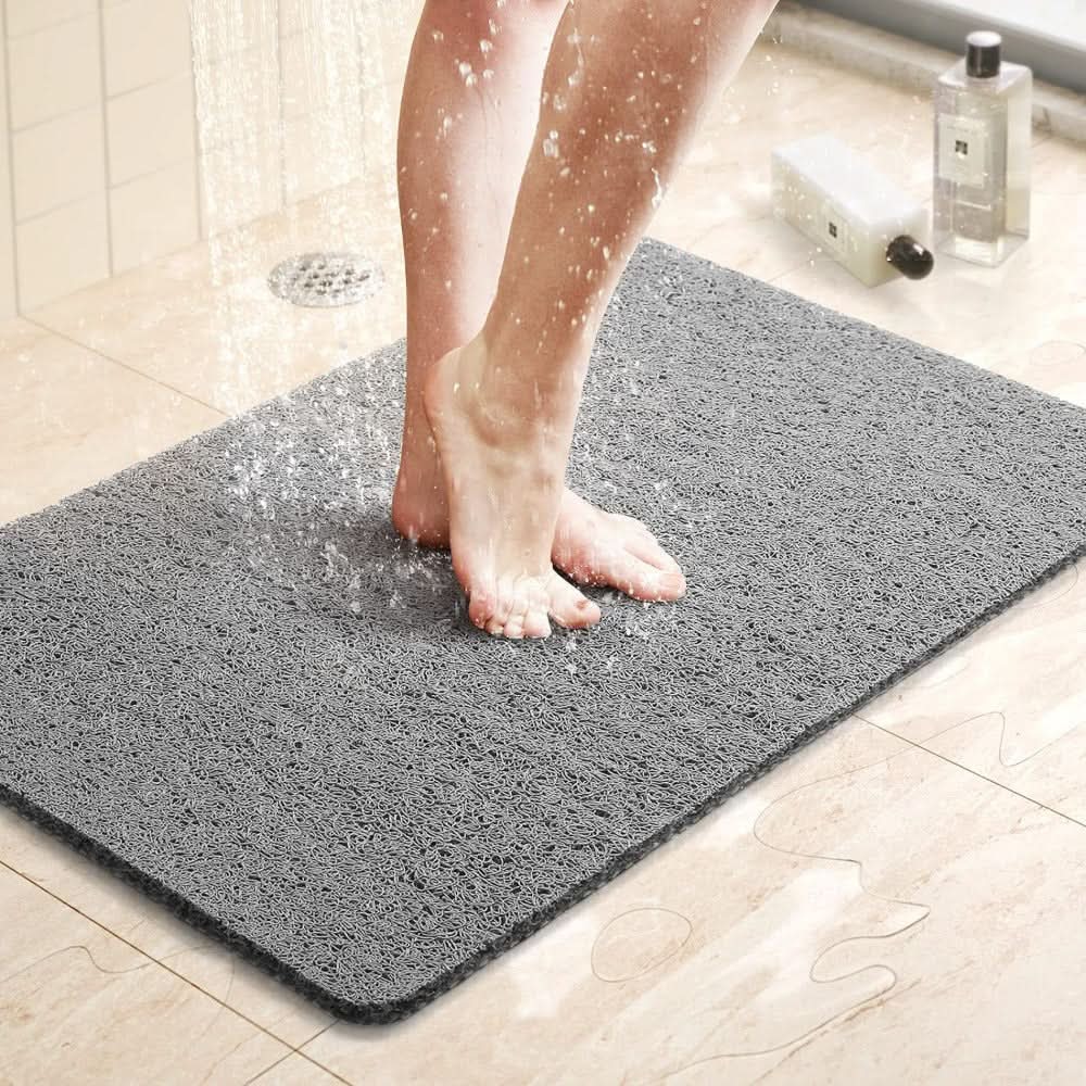 Tapis de douche antidérapant avec système d'évacuation