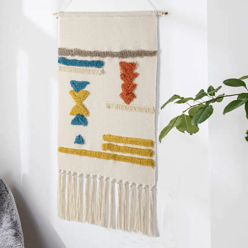 Tapisserie murale tissée à motifs géométriques et franges